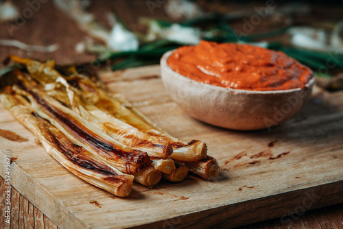 roasted calcots typical of Catalonia on a table photo