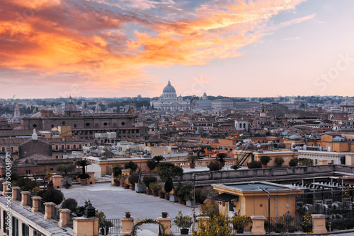 Romantic view of Rome with St Peter's Basilica (San Pietro) in Vatican City, Italy at sunset. It is a famous landmark of Vatican. Nice cityscape of the old Roma in winter