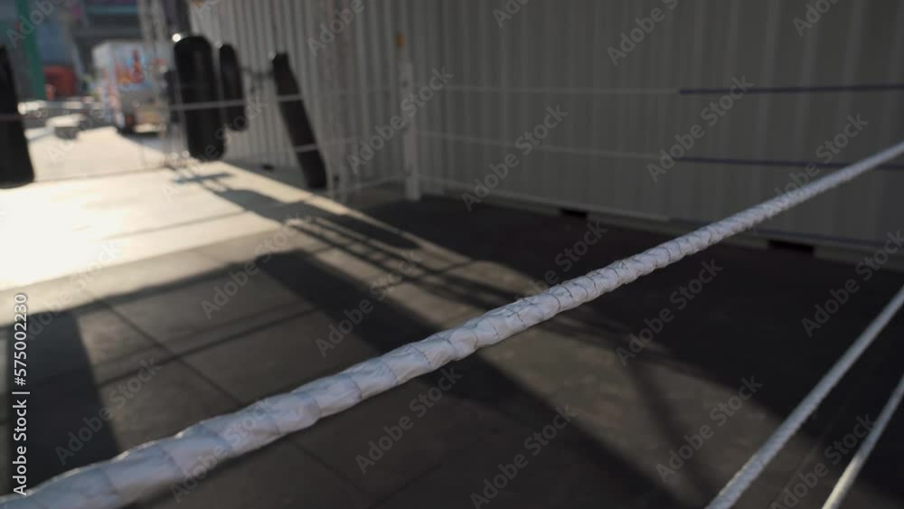 Open air gym for combat and boxing with hanging punching sacks without people. Outdoor area with equipment for training kicks to bags no man. Street court with facilities for practicing hitting bags. Open air gym for combat and boxing with hanging punching sacks without people. Outdoor area with equipment for training kicks to bags no man. Street court with facilities for practicing hitting bags.