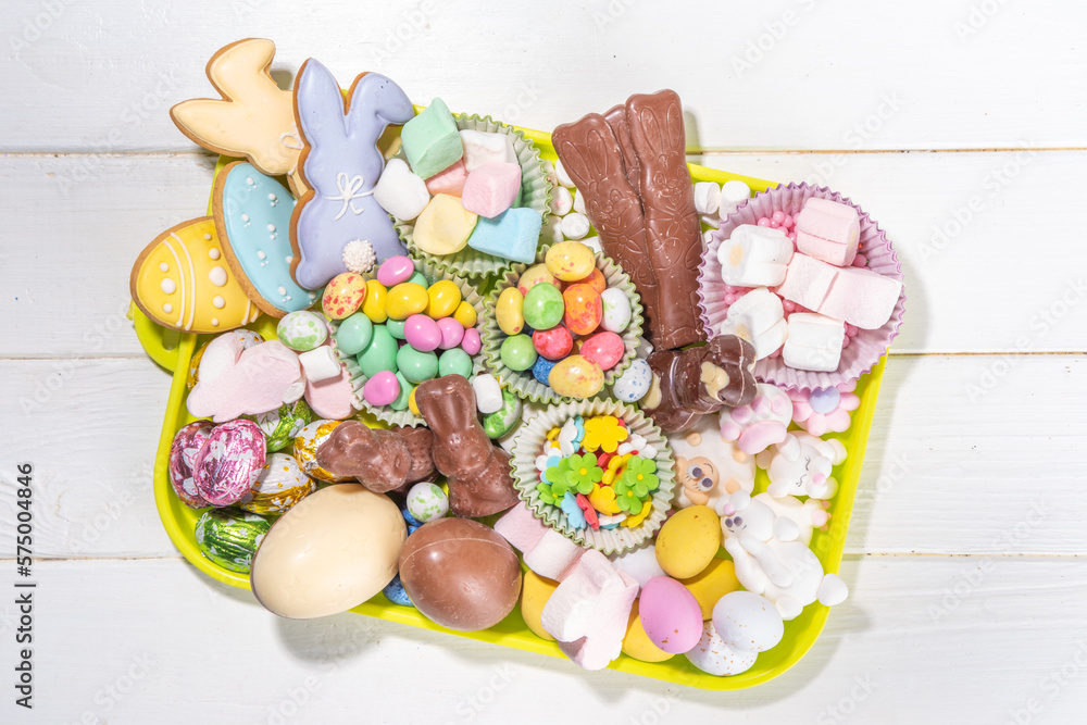 Easter charcuterie board. Sweet Easter party, kids holiday treats assortment - chocolates, easter eggs, marshmallows, candies, chocolate bunny, snacks and treats tray Easter charcuterie board. Sweet Easter party, kids holiday treats assortment - chocolates, easter eggs, marshmallows, candies, chocolate bunny, snacks and treats tray