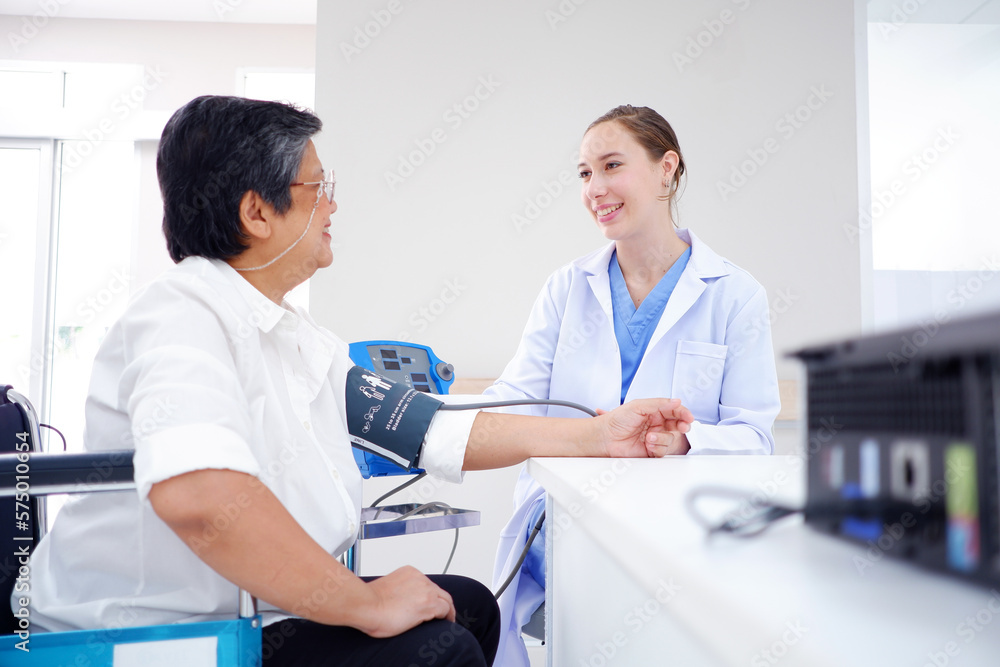 Female doctor measuring blood pressure, old woman patient, medical concept. Female doctor measuring blood pressure, old woman patient, medical concept.
