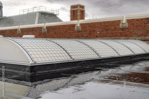 Bilde på lerret Barrel vault skylight screen fall protection guard installed on a commercial, industrial, or school skylight