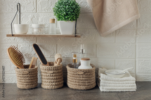 bathroom interior with wicker baskets and accessories for skin and body care, eco friendly concept photo