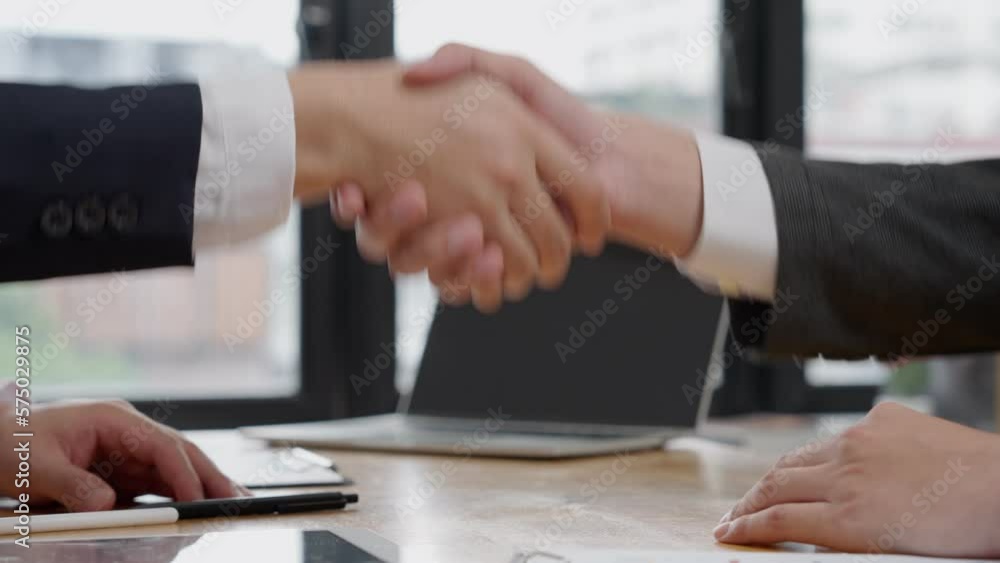Executives are shaking hand after results success to target. financial data analysis and market growth report chart. Planning Strategies, startup project, profitable strategy, Business meeting Executives are shaking hand after results success to target. financial data analysis and market growth report chart. Planning Strategies, startup project, profitable strategy, Business meeting