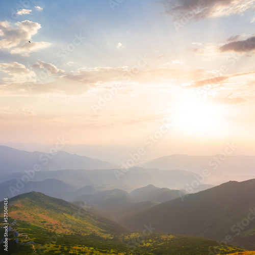 mountain valley in blue mist at the early morning  summer moutain travel background