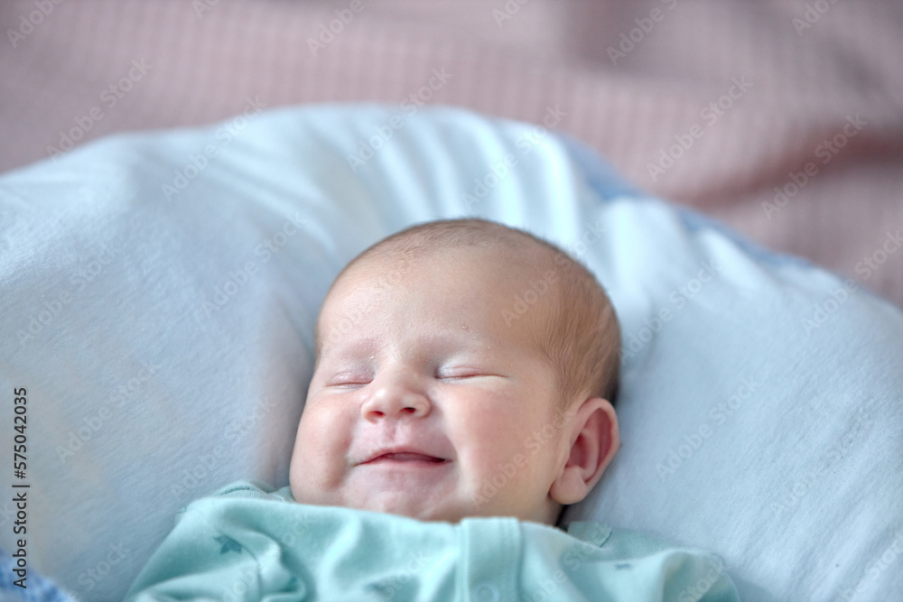 the newborn boy is sleeping. cute beautiful baby is sleeping closeup portrait of a beautiful sleeping baby on white. the newborn boy is sleeping. cute beautiful baby is sleeping closeup portrait of a beautiful sleeping baby on white.