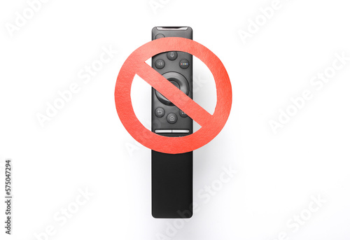 Tv remote with prohibition sign on gray background