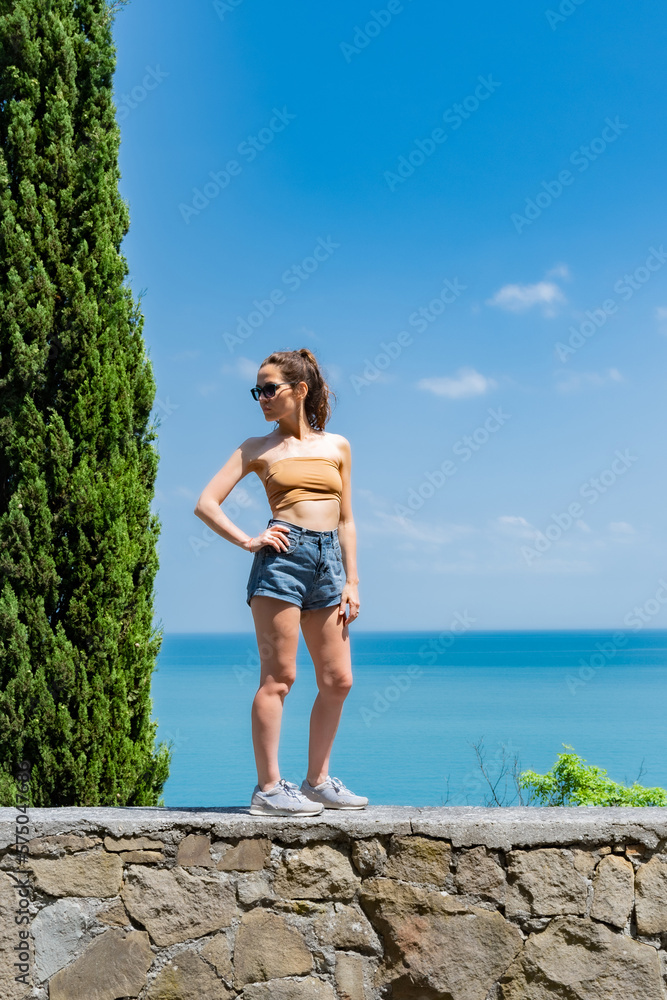 Attractive young woman with glasses on the seashore Attractive young woman with glasses on the seashore