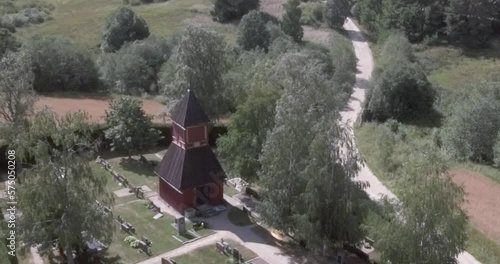 Aerial view of wooden cross church of Uskelan Isokylän emäkirkko in summer, Salo, Finland. photo