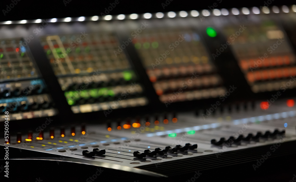 Professional stage lighting controller desk. Industrial light board on concert in music hall.