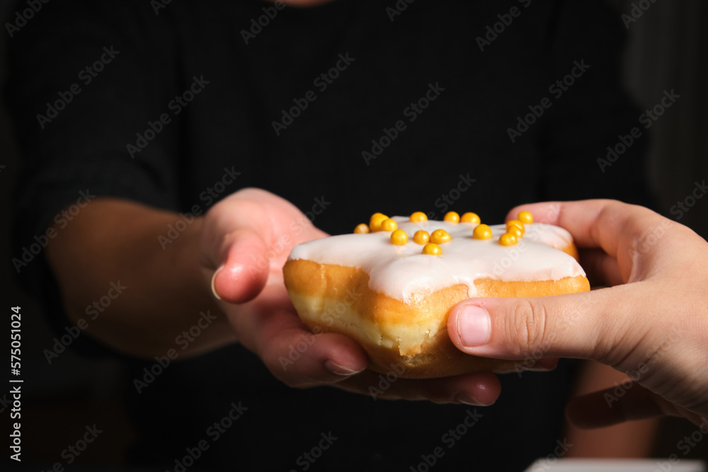 star-shaped doughnut in a woman's hand