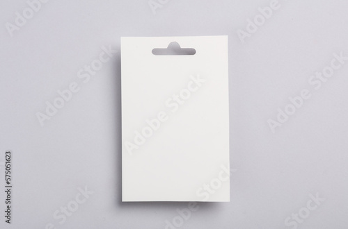 White ID card badge on gray background. Mockup for design template
