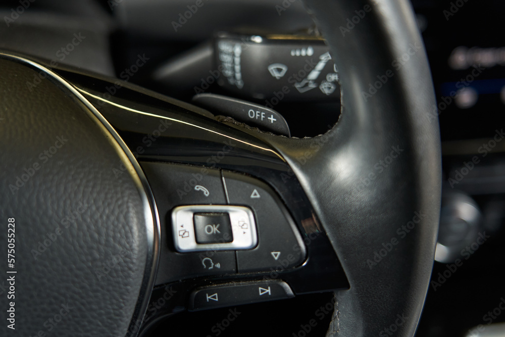 car steering wheel paddles, multimedia adjustment and flipping through song tracks on the steering wheel spoke