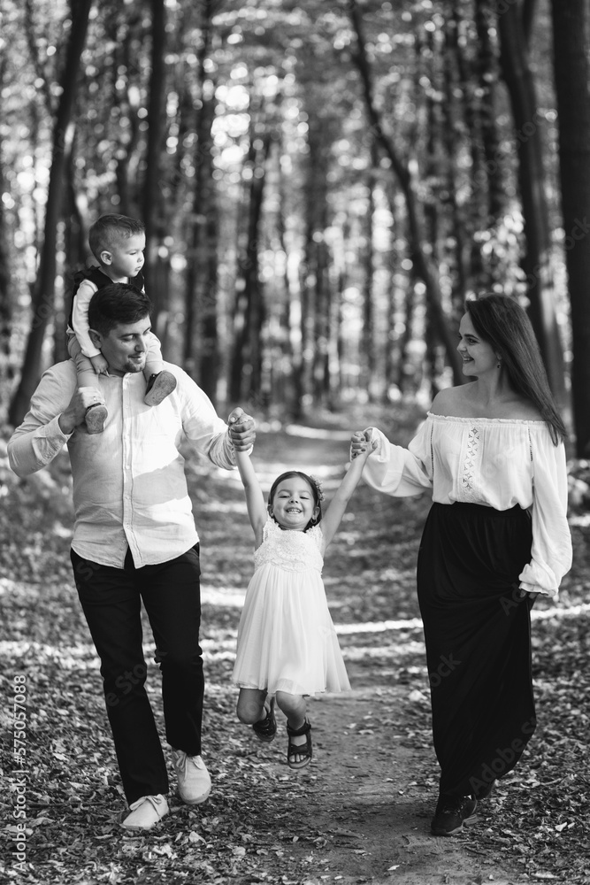 Obraz premium Family with daughter and son together in park
