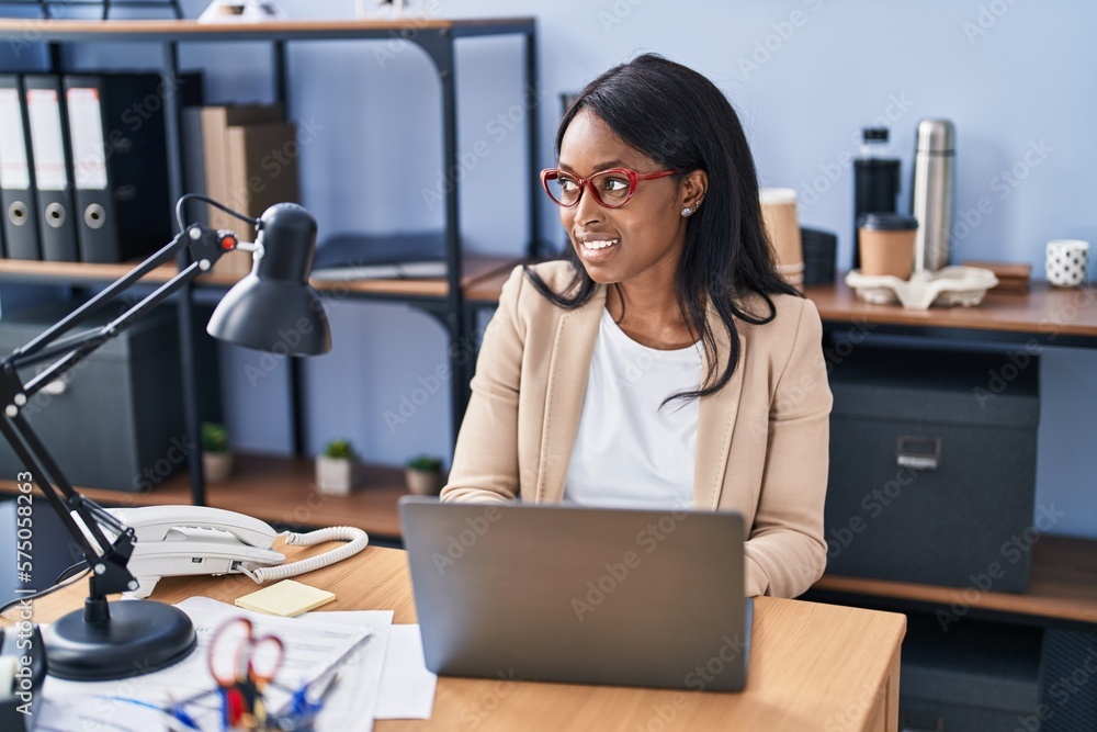 Young african american woman business worker using laptop working at office Young african american woman business worker using laptop working at office