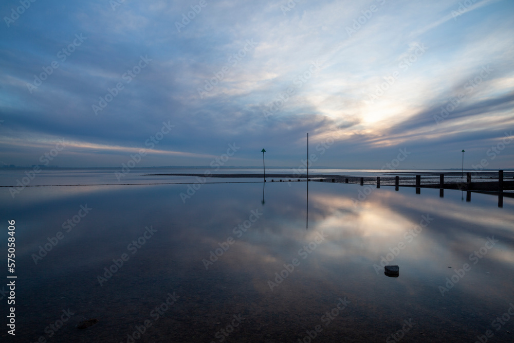 Reflections on Westcliff beach, Essex, England, United Kingdom