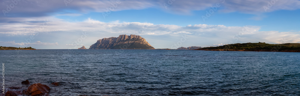 Rocky and Sandy Beach in Porto Istana, Sardinia, Italy. Tavolara Island in Background. Nature Panorama Rocky and Sandy Beach in Porto Istana, Sardinia, Italy. Tavolara Island in Background. Nature Panorama