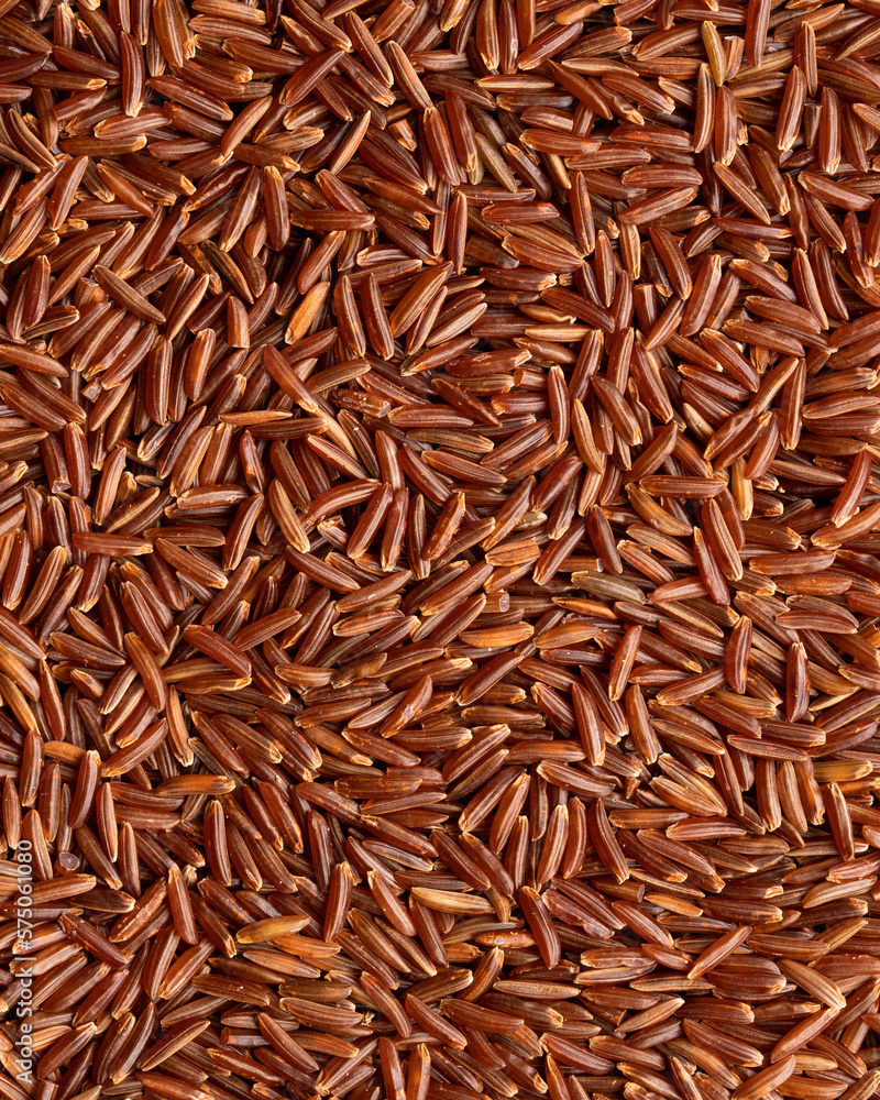 Texture of Organic Raw Red Rice. Red Rice Background. Healthy Eating Concept
