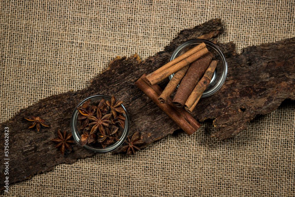 Spices on the bark from a tree against the background of burlap