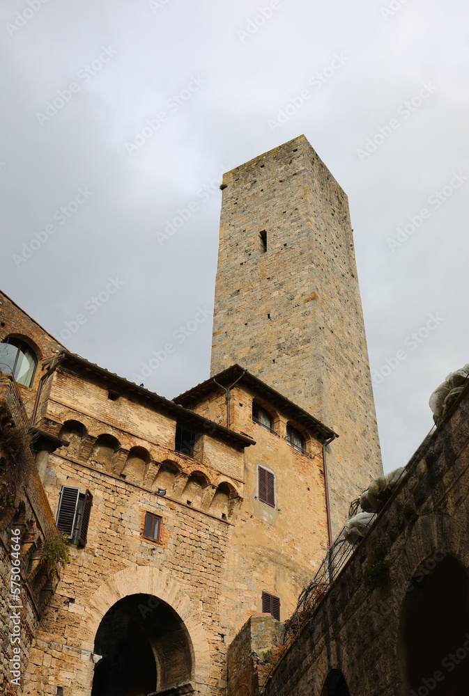 Ancient tower and medieval houses of the village of San Gimignano in Italy near Siena