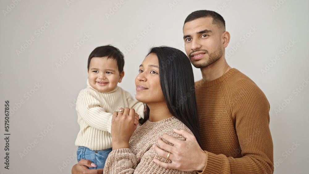 Couple and son hugging each other standing over isolated white background Couple and son hugging each other standing over isolated white background