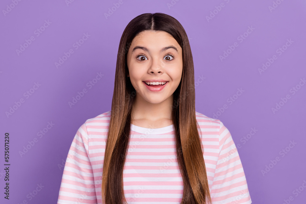 Photo of pretty impressed young girl dressed striped white pink t-shirt smiling isolated purple color background Photo of pretty impressed young girl dressed striped white pink t-shirt smiling isolated purple color background