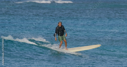 Canvas Print Mature man surfer surfing ocean waves