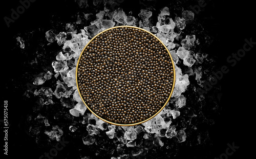 Photos Tin of Caviar on ice on black background