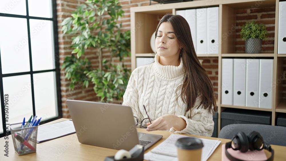 Young beautiful hispanic woman business worker using laptop working at office Young beautiful hispanic woman business worker using laptop working at office