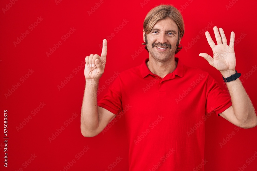 Caucasian man with mustache standing over red background showing and pointing up with fingers number six while smiling confident and happy. Caucasian man with mustache standing over red background showing and pointing up with fingers number six while smiling confident and happy.