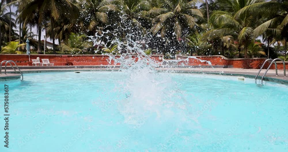 Cape Coast Ghana beach resort woman swim pool. Luxury tropical resort