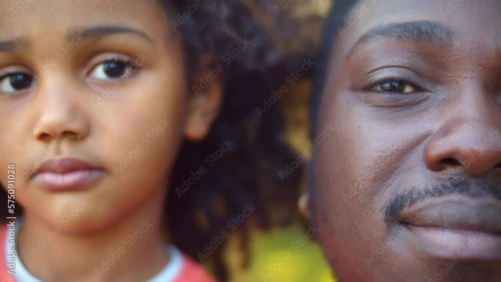 Close up face portrait of African-American father and daughter. Realtime Close up face portrait of African-American father and daughter. Realtime