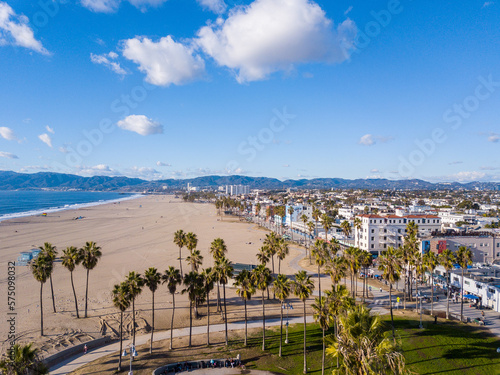 Aerial photography of the venice beach boardwalk, shops, vendors, venice skate park, roller skating area, graffiti walls, beach, and other public areas. Photos taken with a drone in December.