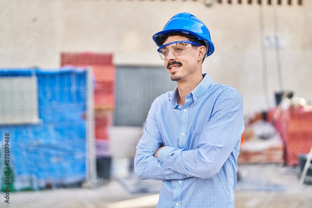 Young caucasian man architect smiling confident standing with arms crossed gesture at street Young caucasian man architect smiling confident standing with arms crossed gesture at street