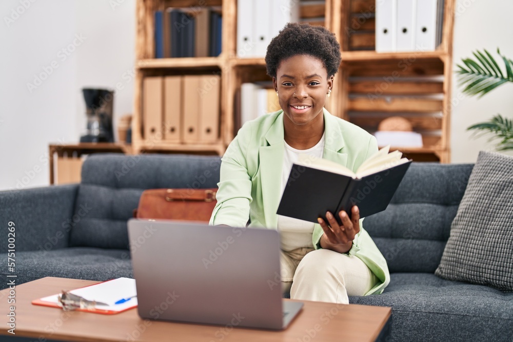 African american woman psychologist working sitting on sofa at psychology center African american woman psychologist working sitting on sofa at psychology center