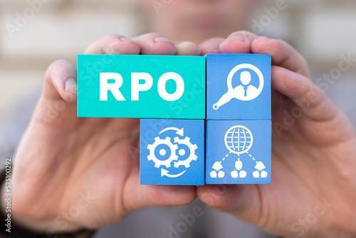 Businessman holding colorful styrofoam blocks with abbreviation: RPO. Concept of RPO - Recruitment Process Outsourcing. Outsource recruitment.