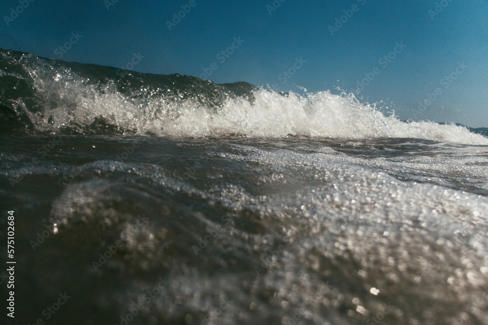 Ocean Wave Crashes Against Blue Sky in Spain Ocean Wave Crashes Against Blue Sky in Spain