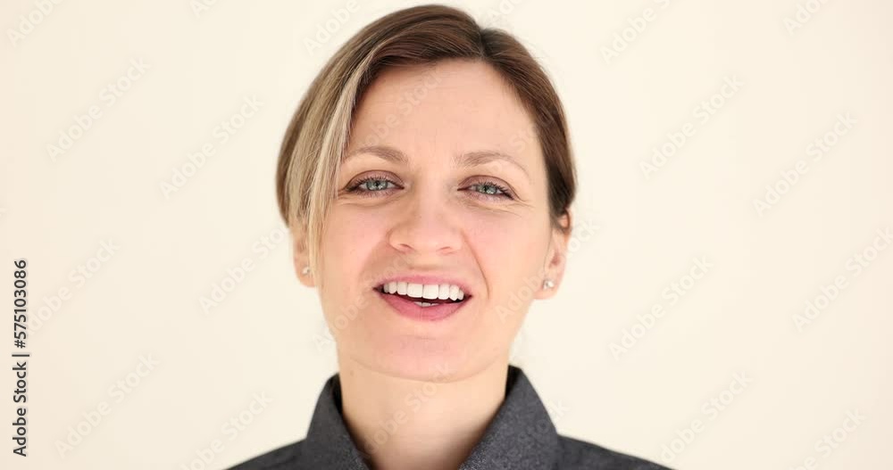 Portrait of beautiful happy woman smiling with white teeth Portrait of beautiful happy woman smiling with white teeth