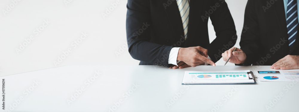 The sales department is having a monthly summary meeting to bring it to the department manager, they are verifying the correctness of the documents that are prepared before bringing in to the manager The sales department is having a monthly summary meeting to bring it to the department manager, they are verifying the correctness of the documents that are prepared before bringing in to the manager