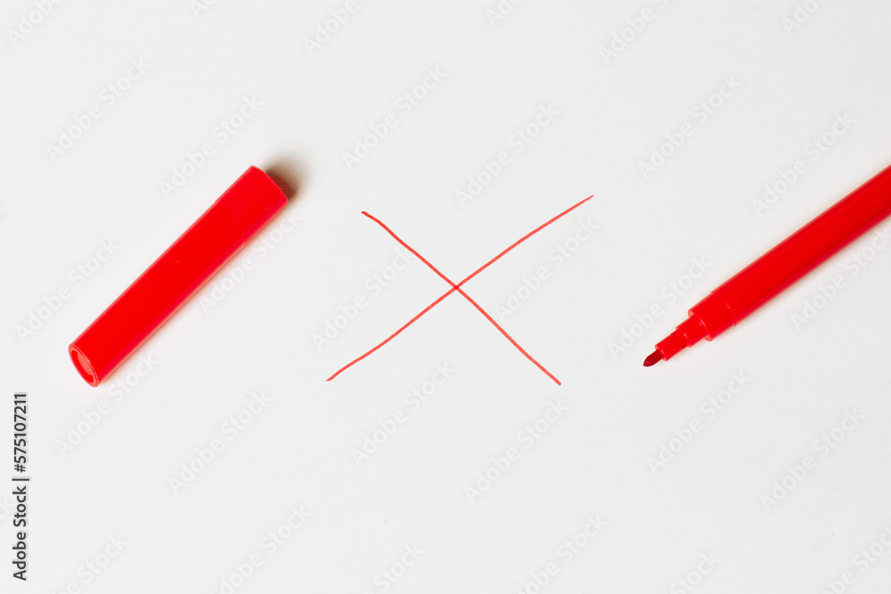 Red marker with a cap. On a white background. Prohibition sign. cross Red marker with a cap. On a white background. Prohibition sign. cross