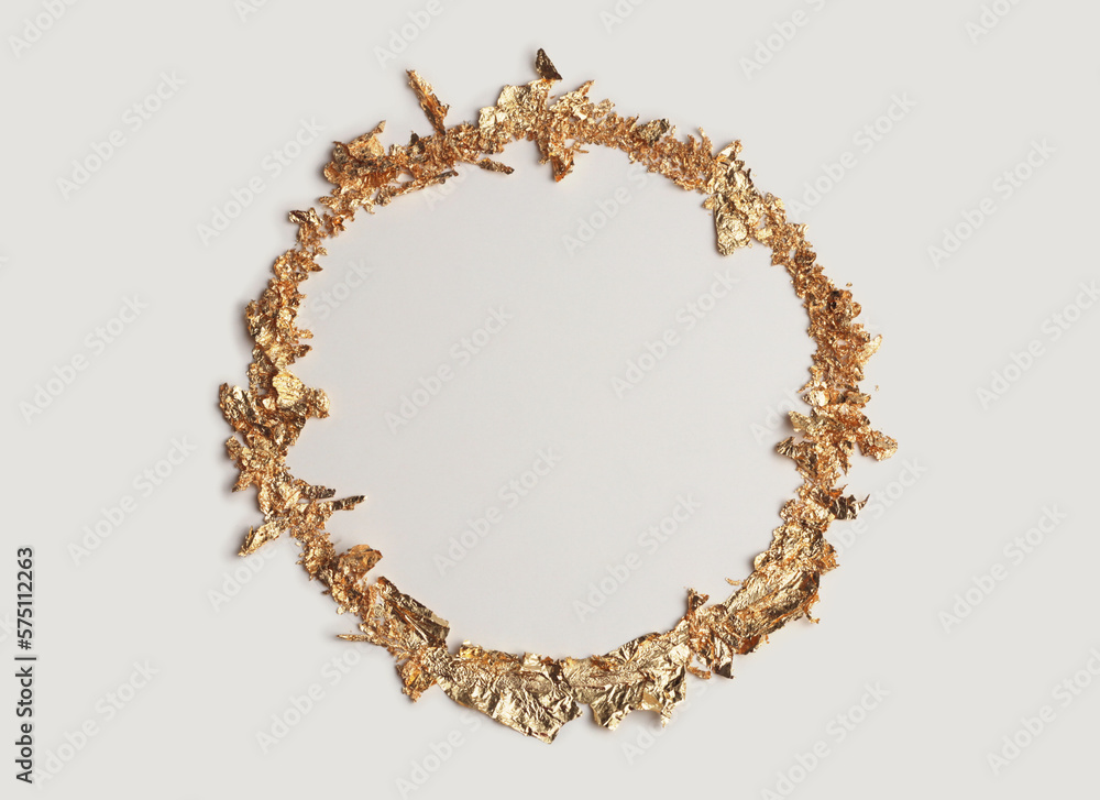 Obraz premium Gold (bronze) glitter empty circle frame on beige gray paper background. Abstract copy space texture.