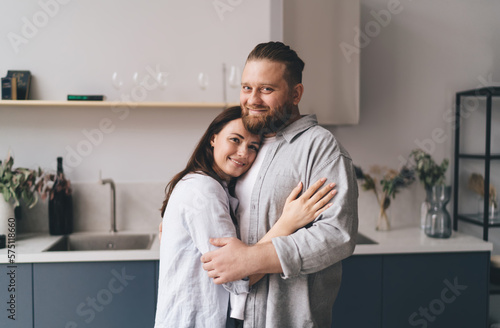 Loving couple embracing in kitchen