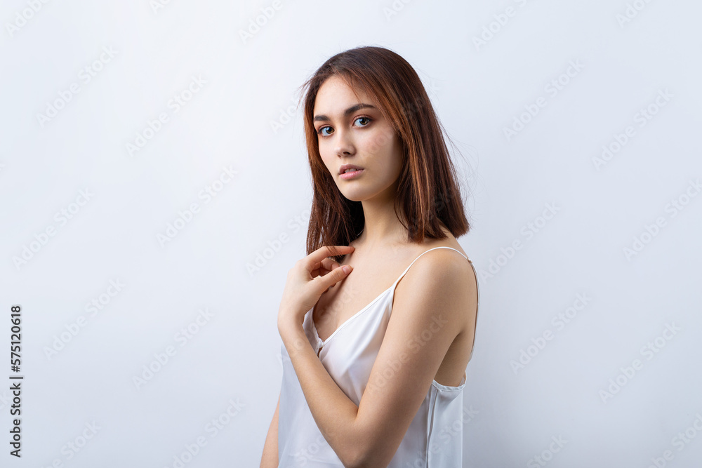 Beautiful smiling woman with clean skin, natural make-up and white teeth on a gray background Beautiful smiling woman with clean skin, natural make-up and white teeth on a gray background
