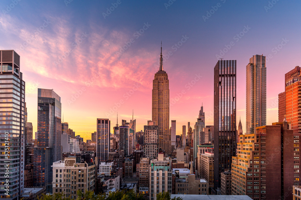 New York, USA - April 23, 2022: New York skyline at the end of sunset with Empire State Building in foreground - obrazy, fototapety, plakaty 
