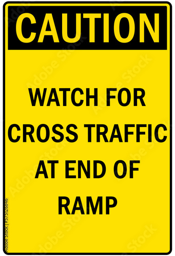Garage sign and labels watch for cross traffic at end of ramp