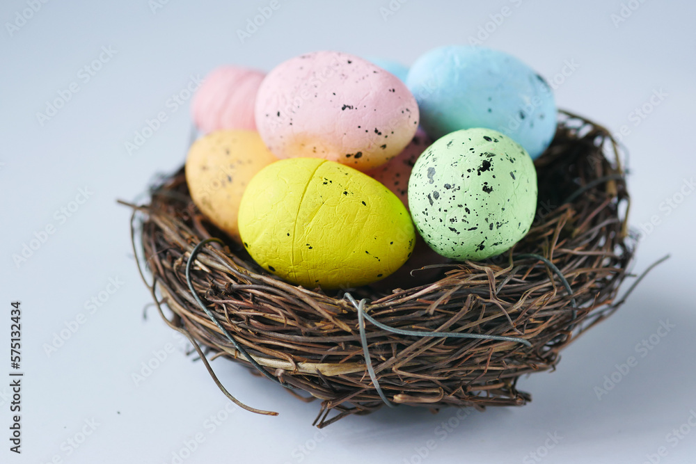 Obraz premium easter concept with multi color egg on pink background.