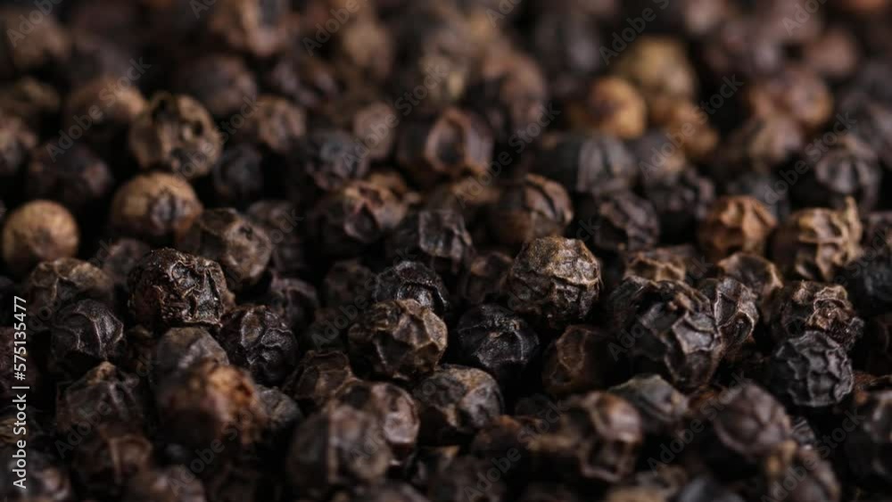 black peppercorns in motion as background 4k 30fps video black peppercorns in motion as background 4k 30fps video