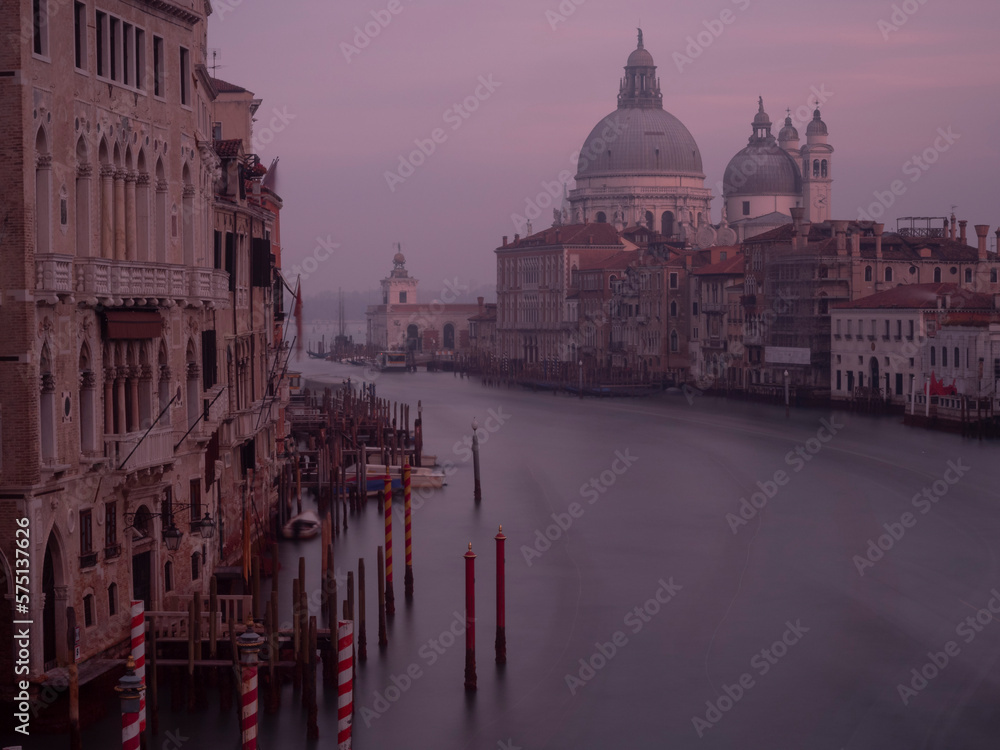 Grand Canal, Venice, Italy. Very early at dawn, long exposure. Basilica di Santa Maria della Salute in distance.