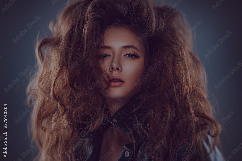 Young woman with lush hair fashion portrait Young woman with lush hair fashion portrait