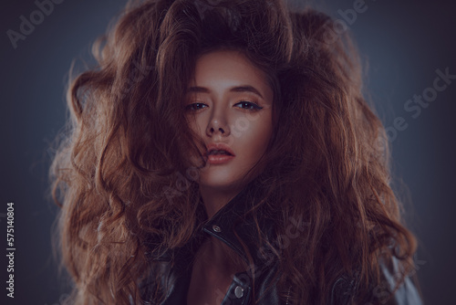 Young woman with lush hair fashion portrait